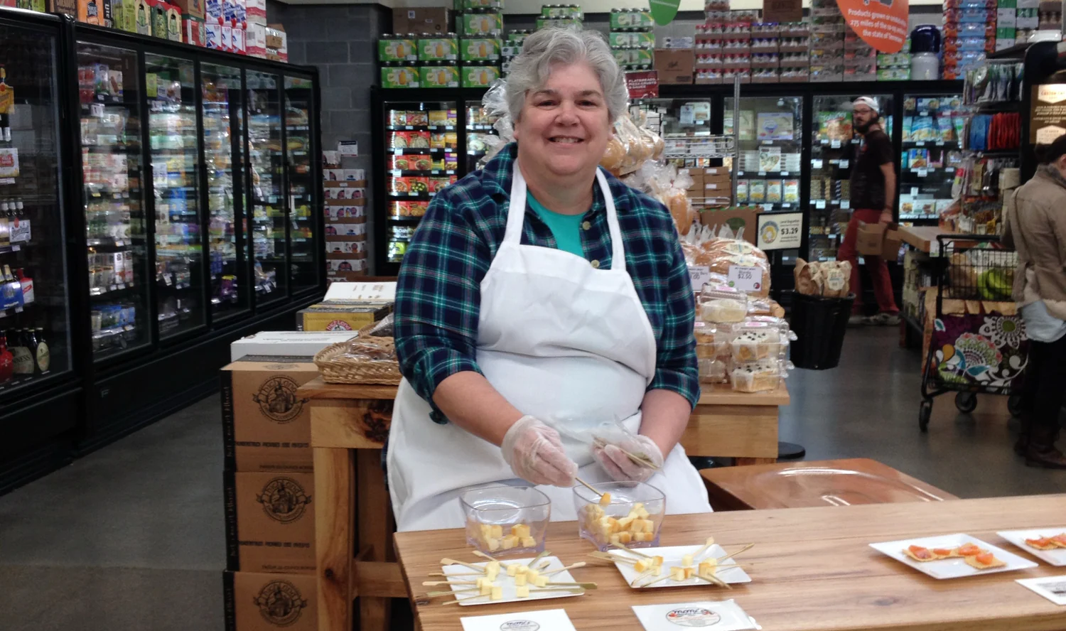 vicki_sampling_smoked_cheeses_0cc74611-99fe-4f90-8319-9a553f5b0167
